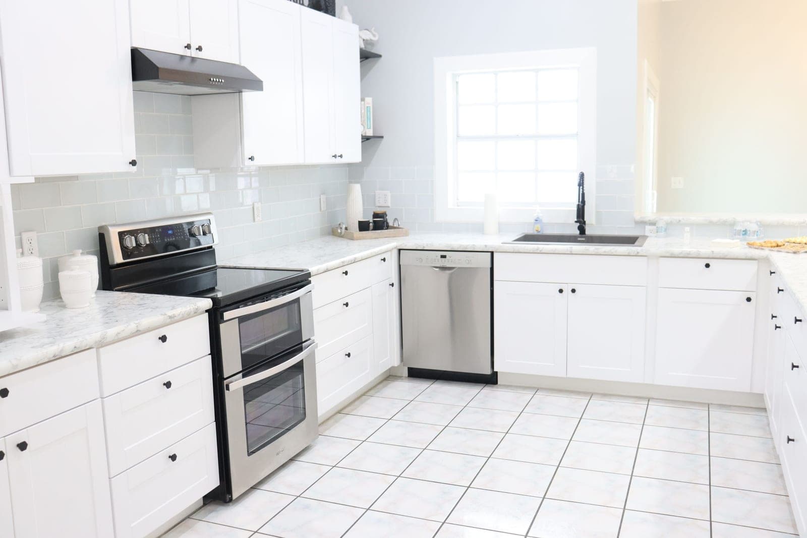 Reference photo of a bright, clean kitchen with tile flooring