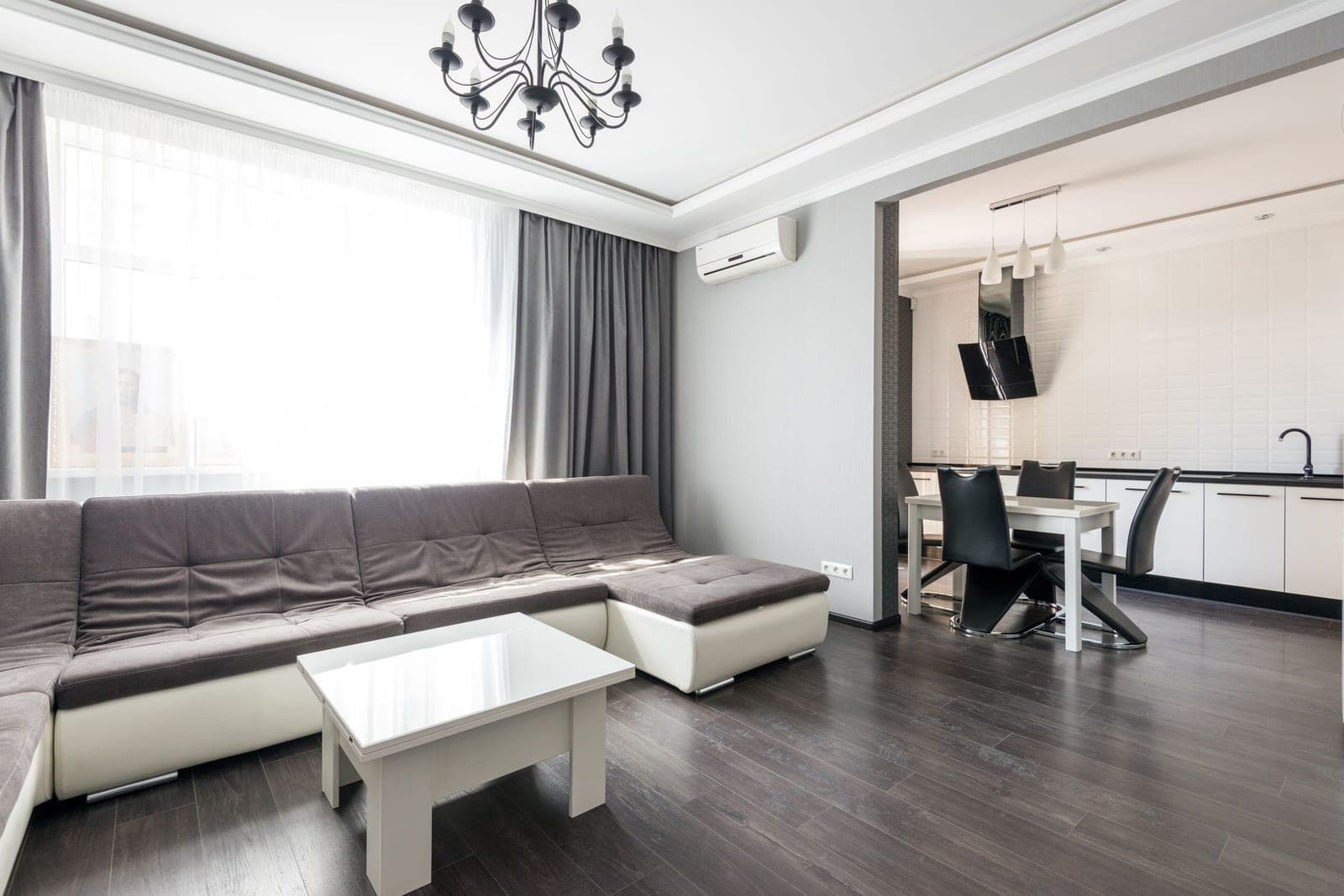 Reference photo of a tidy open-plan living room and kitchen